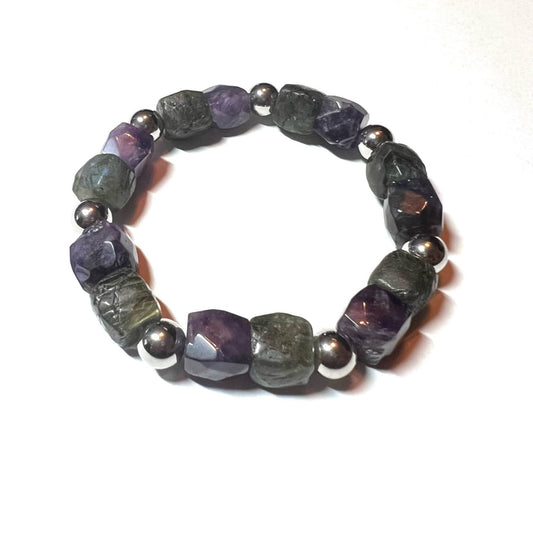 This handmade bracelet features natural Labradorite & Amethyst beads. Labradorite boosts strength and intuition, while Amethyst aids spiritual growth. Each bead is carefully crafted to bring balance and healing, making it a thoughtful, meaningful gift for loved ones.