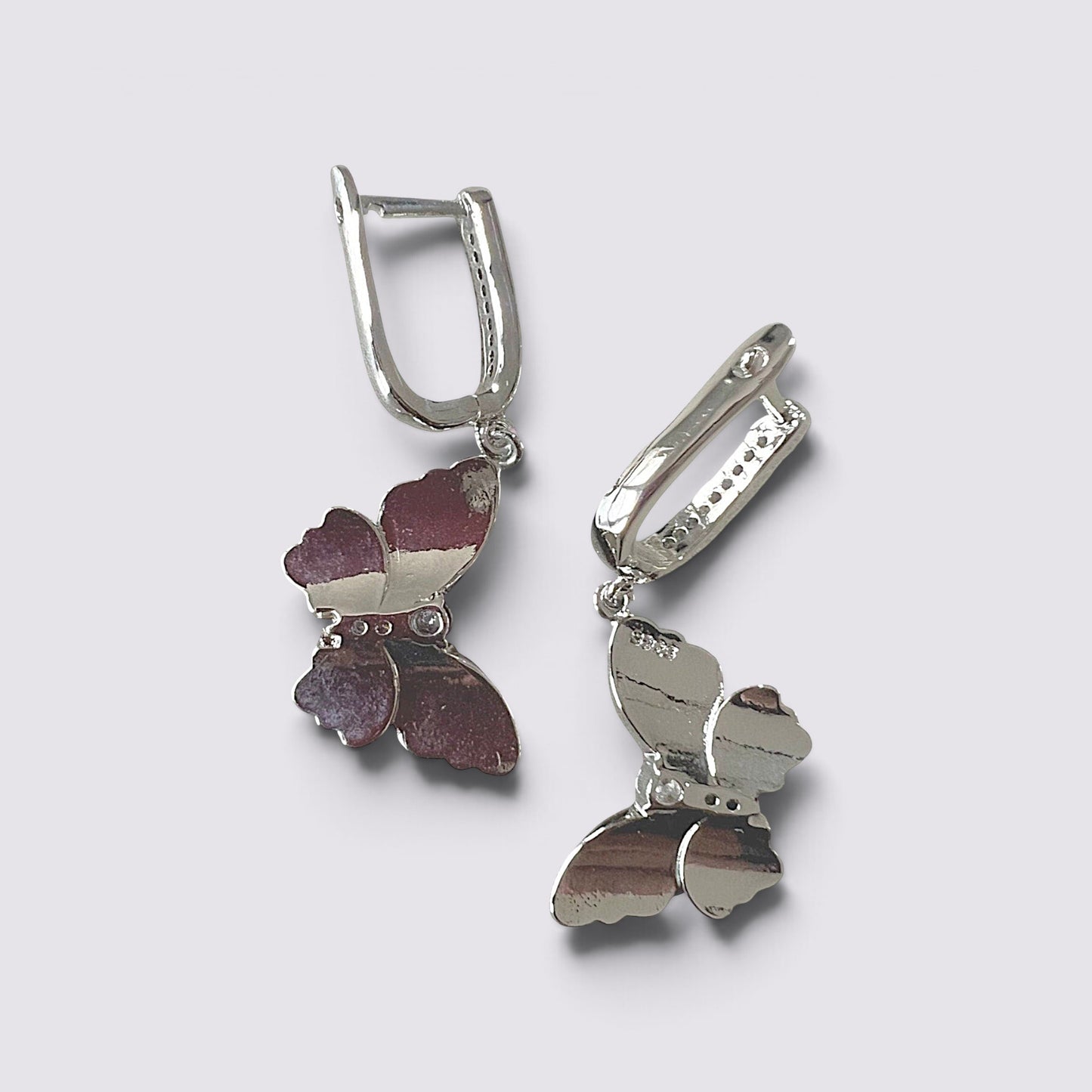 The Fashion Jewels pink enameled butterfly drop earrings with sparkling accents and polished silver-tone finish.