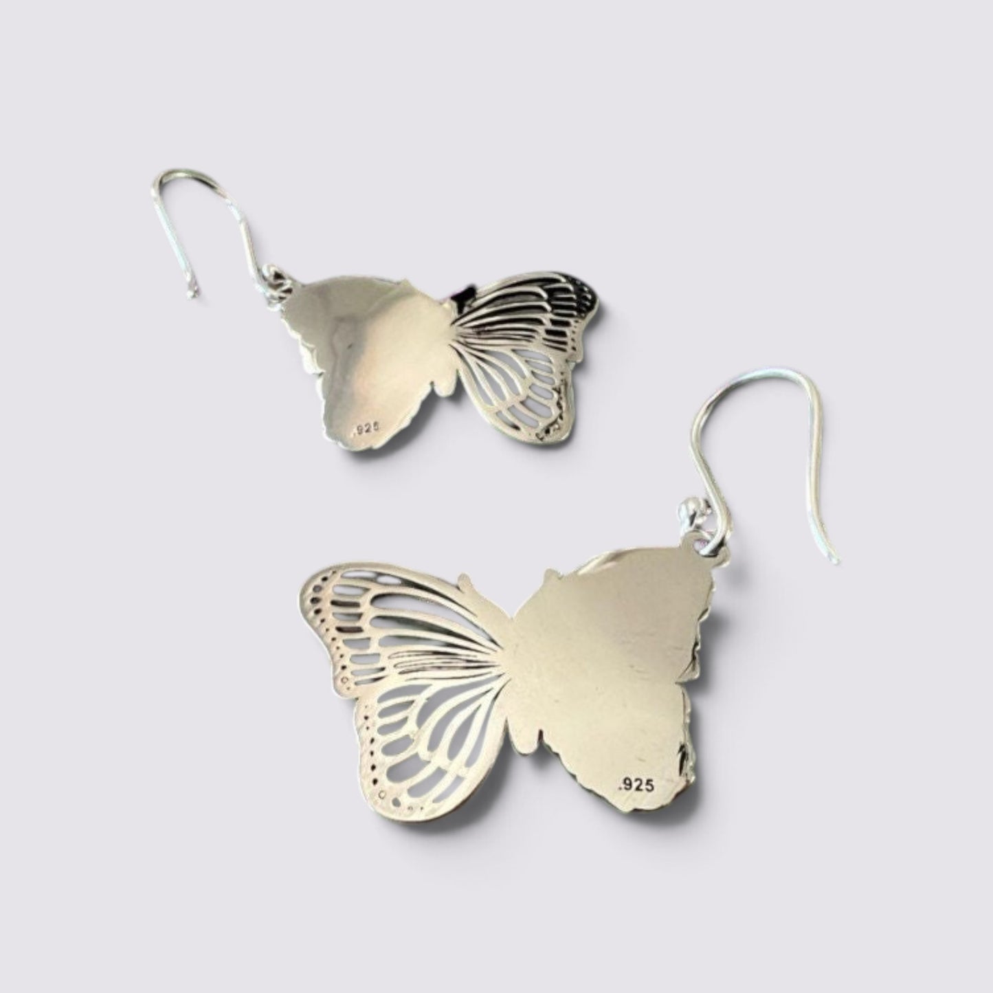The Fashion Jewels sterling silver butterfly drop earrings with intricate wing detailing and hook backings.