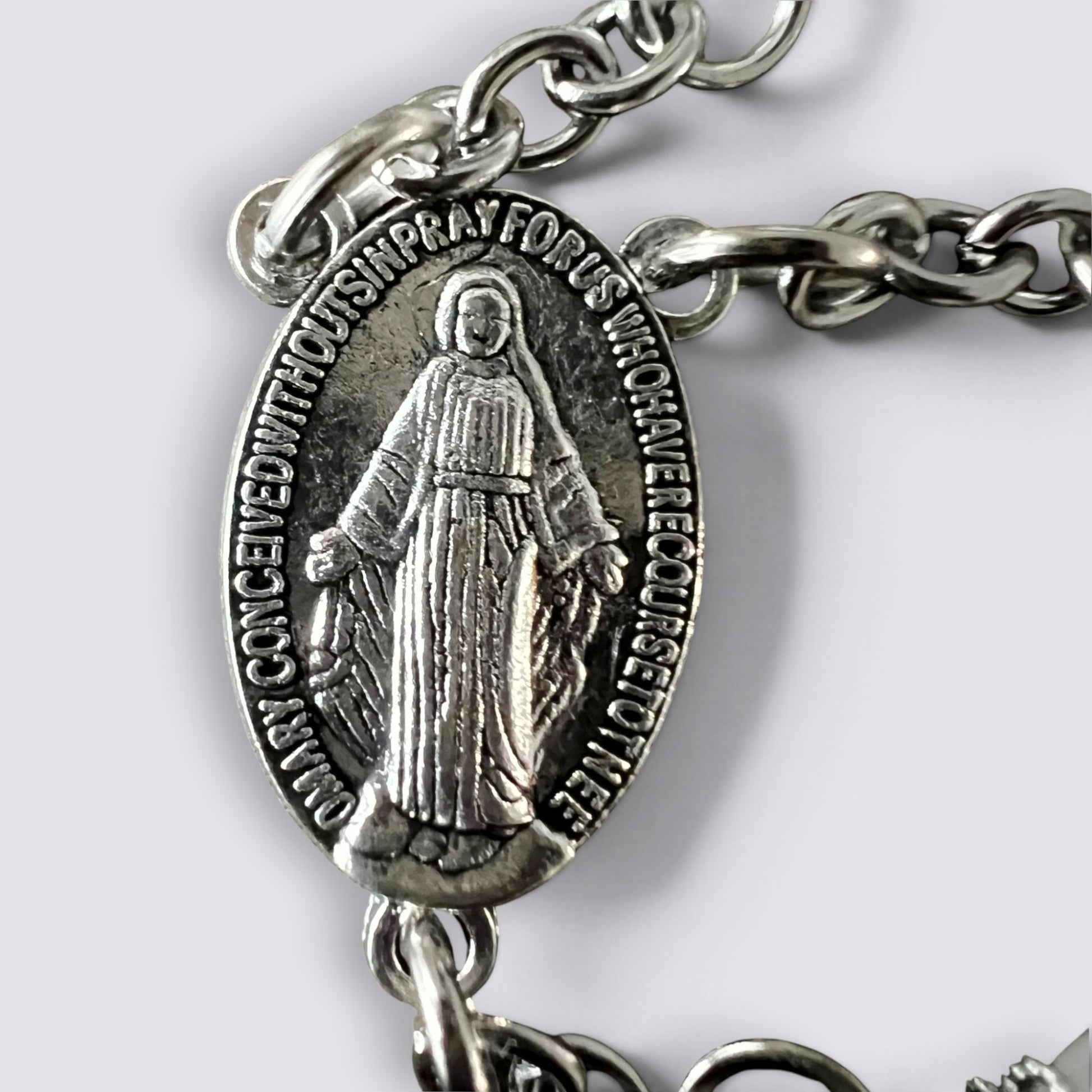 The Fashion Jewels silver-tone Miraculous Medal centerpiece on a durable metal chain for a religious rosary necklace.