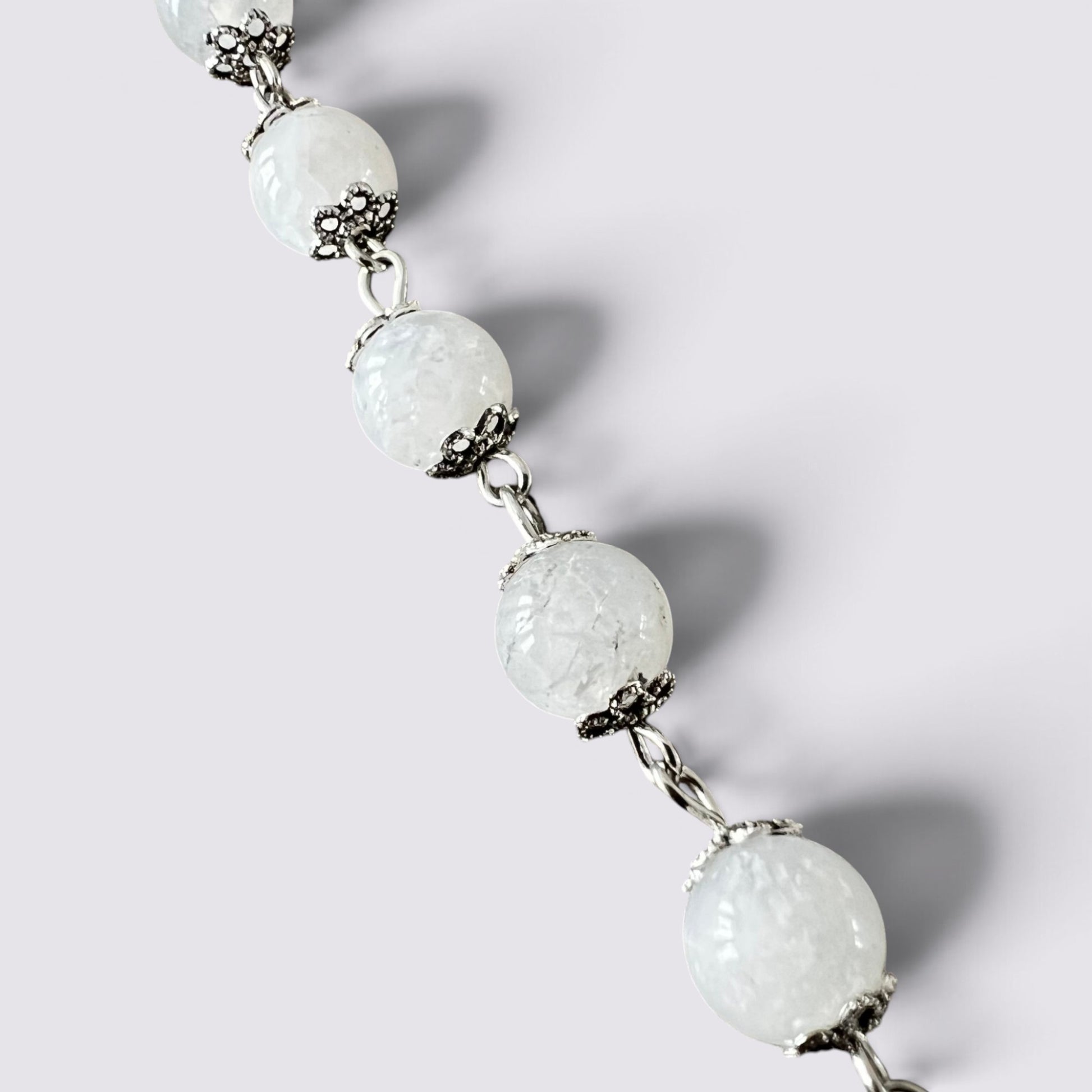The Fashion Jewels handcrafted rosary featuring luminous moonstone beads with intricate vintage silver-tone metal caps.