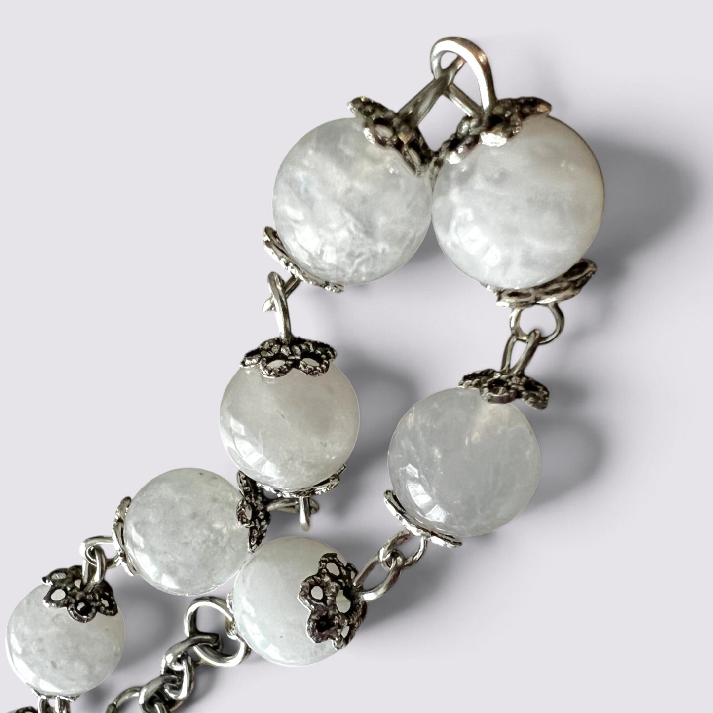 The Fashion Jewels handcrafted rosary featuring luminous moonstone beads with intricate vintage silver-tone bead caps.