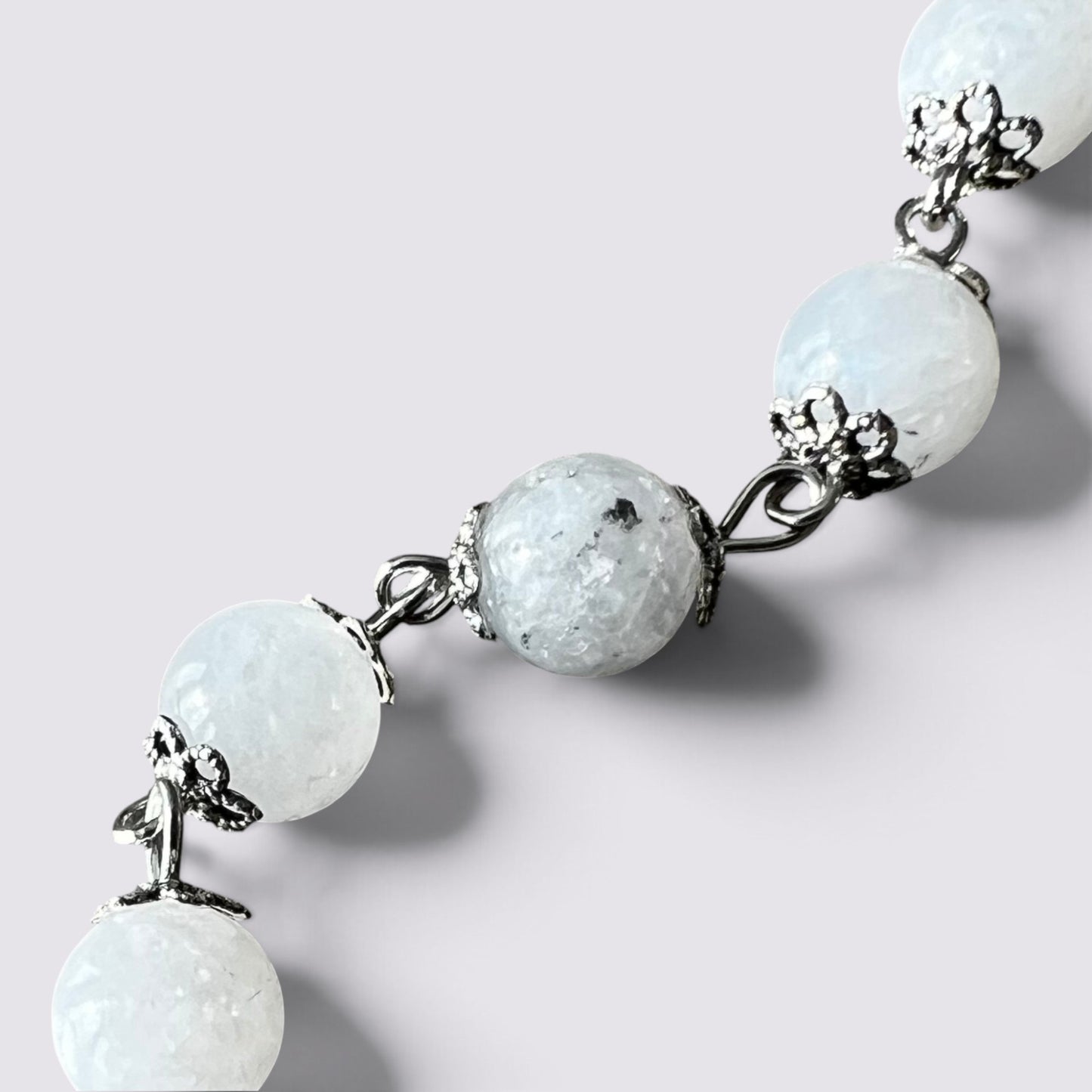The Fashion Jewels handcrafted rosary featuring luminous moonstone beads with intricate silver-tone vintage bead caps.