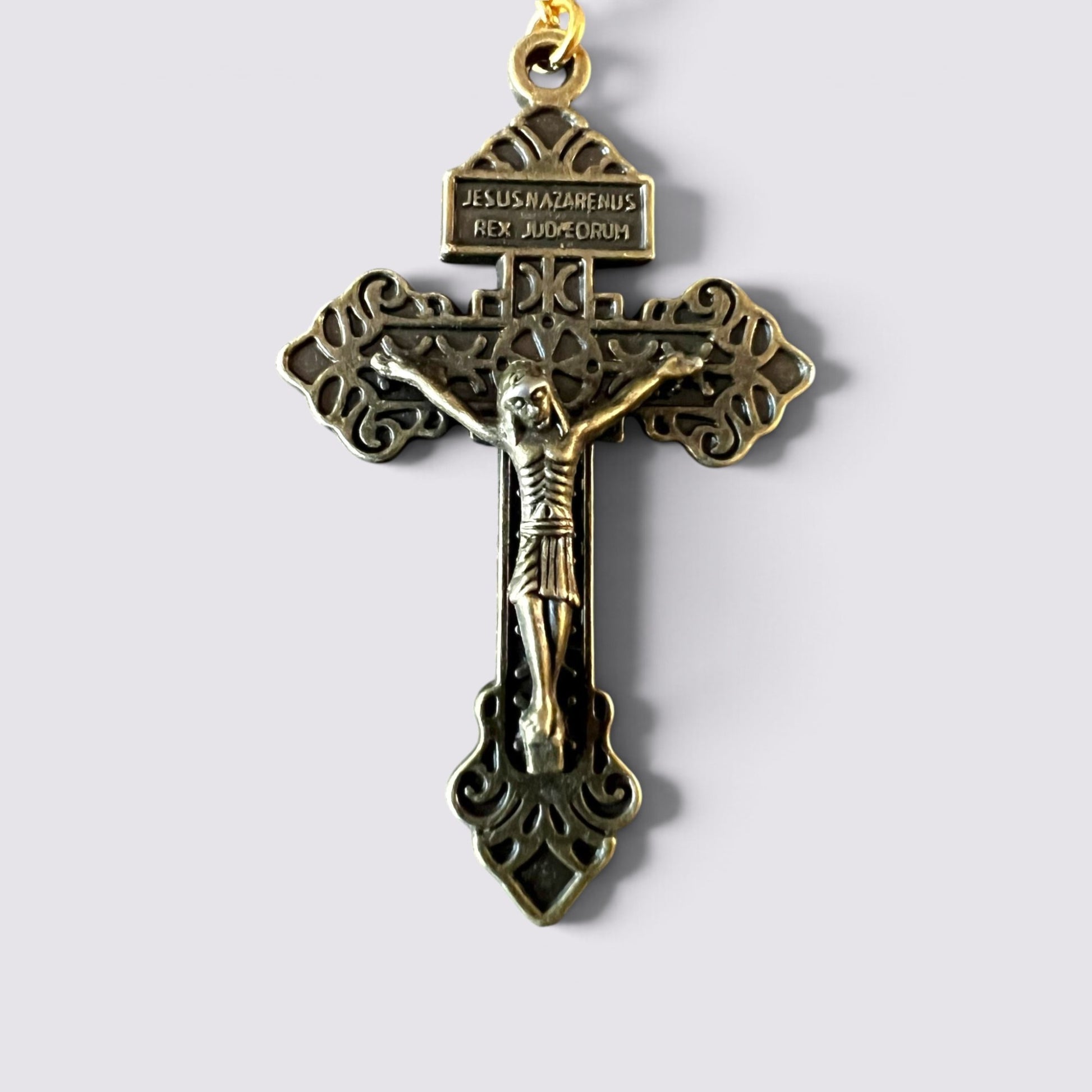 The Fashion Jewels ornate antique-finish metal crucifix pendant with detailed filigree and INRI inscription.