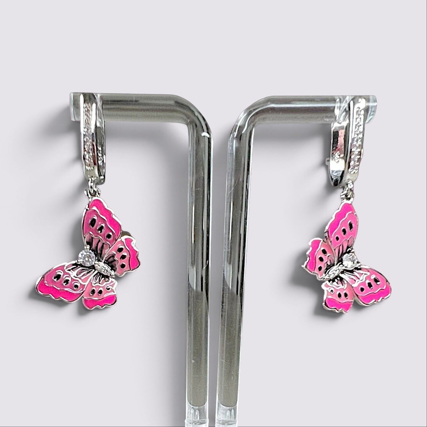 The Fashion Jewels pink enameled butterfly drop earrings with sparkling accents on silver-tone hoops.