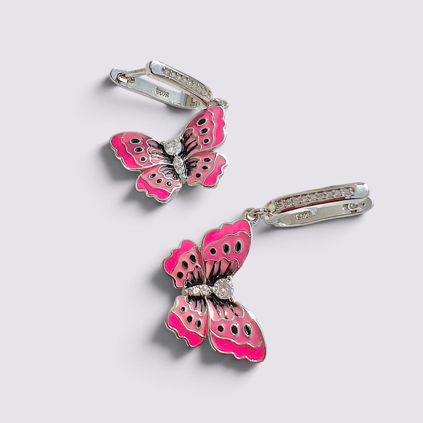 The Fashion Jewels pink enameled butterfly drop earrings with sparkling accents and polished silver-tone metal finish