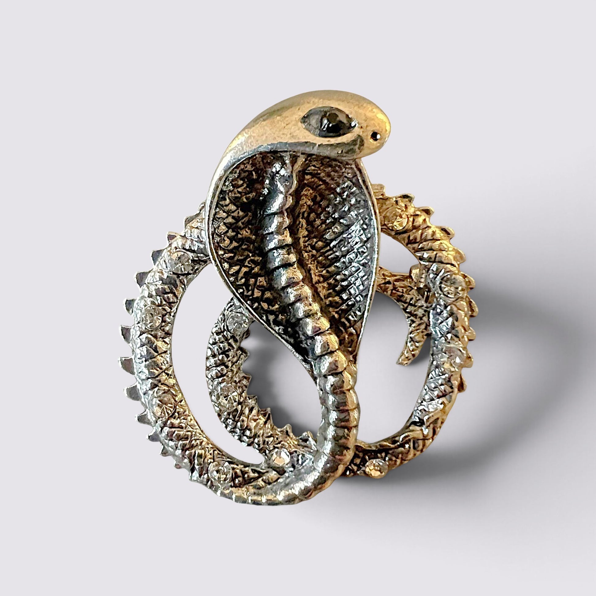 The Fashion Jewels silver cobra serpent brooch with intricate scale detailing and sparkling crystal accents.