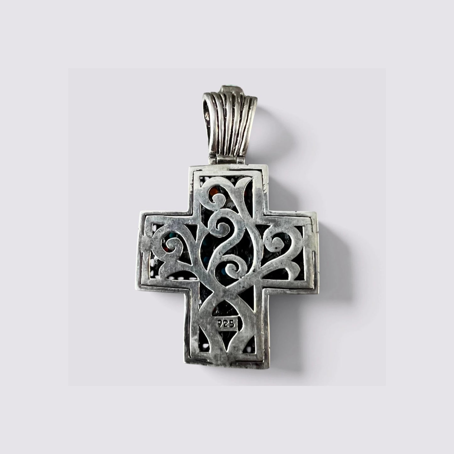 The Fashion Jewels sterling silver cross pendant back view featuring intricate oxidized scrollwork and 925 hallmark