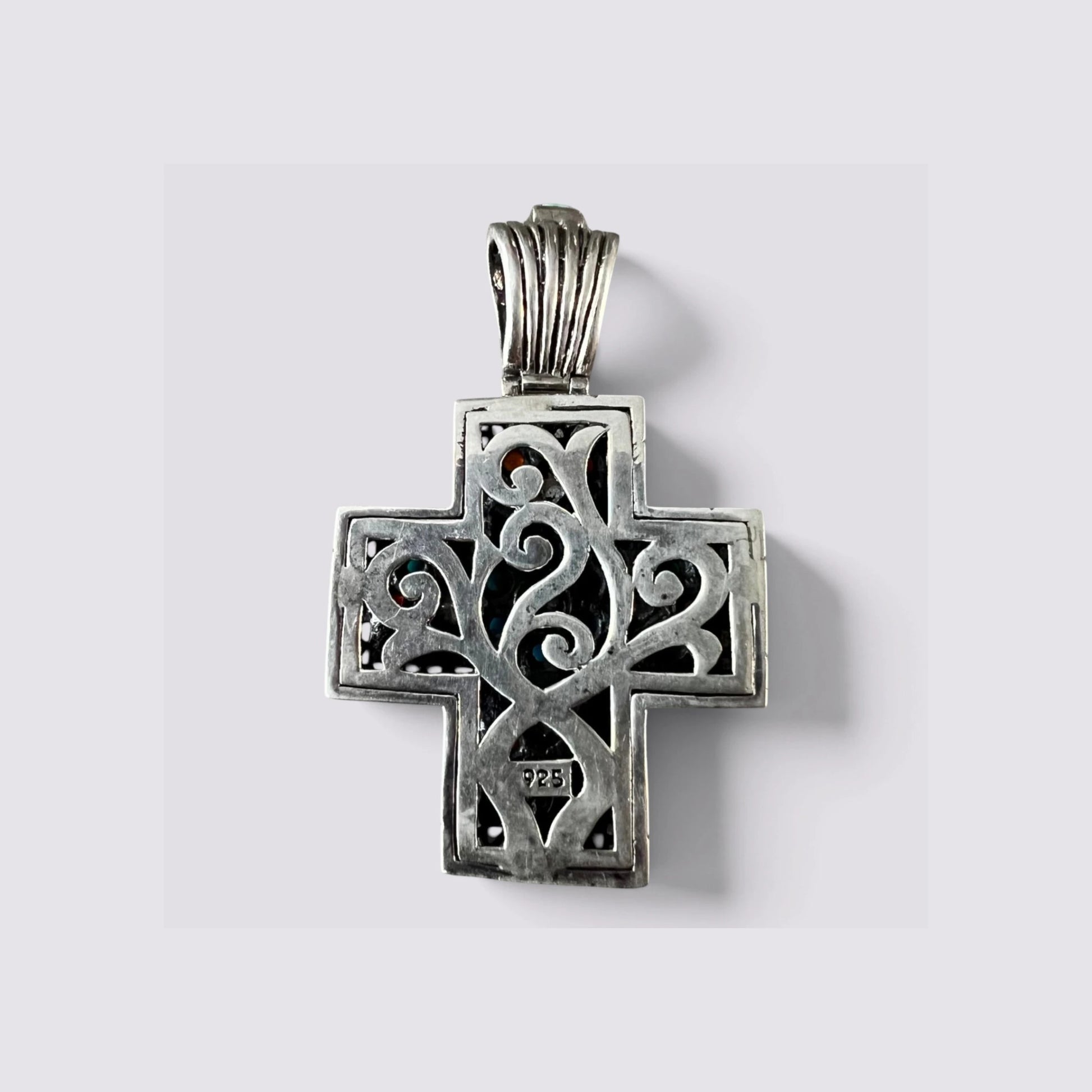 The Fashion Jewels sterling silver cross pendant back view featuring intricate oxidized scrollwork and 925 hallmark