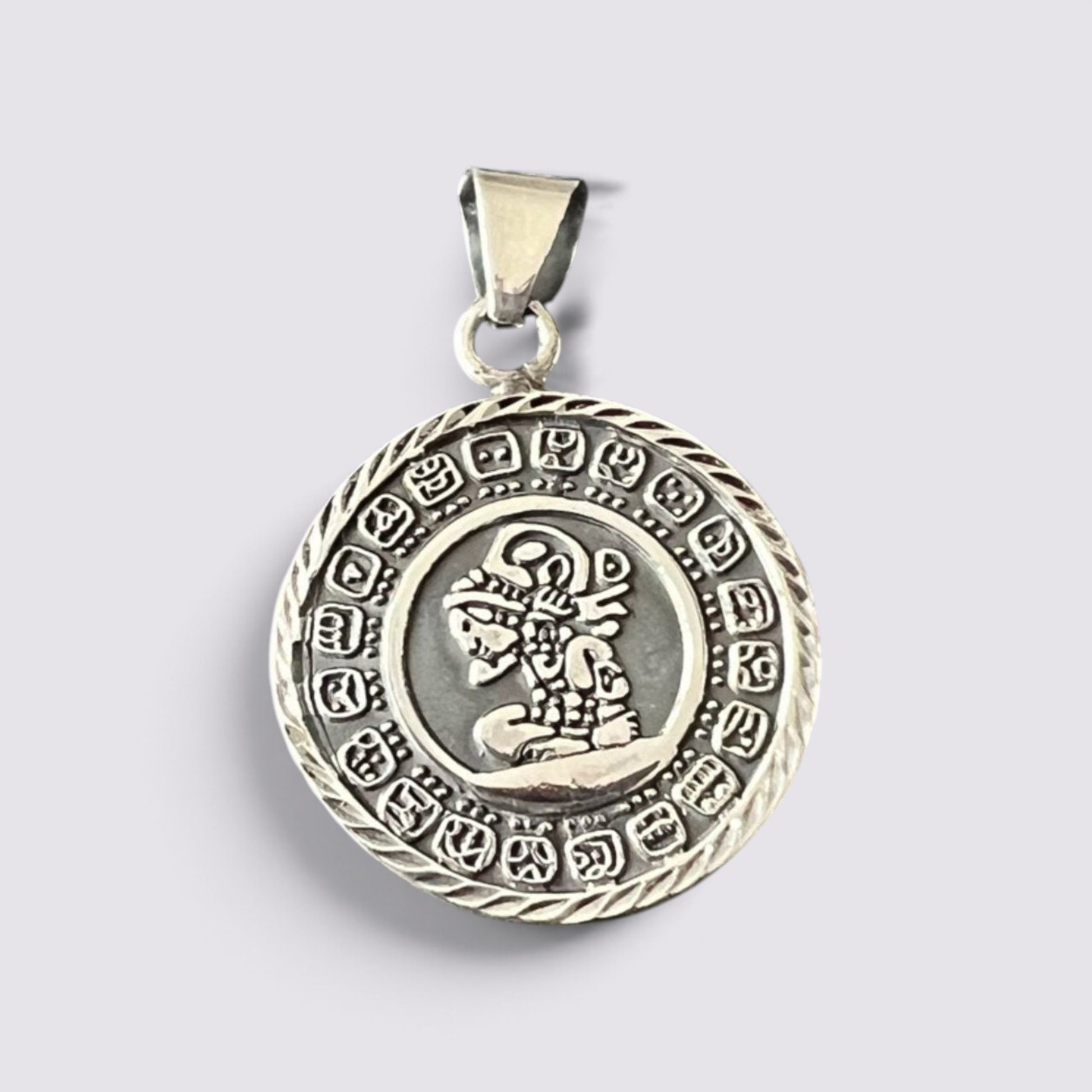 The Fashion Jewels handmade silver Mayan calendar pendant featuring intricate circular Aztec-inspired engravings