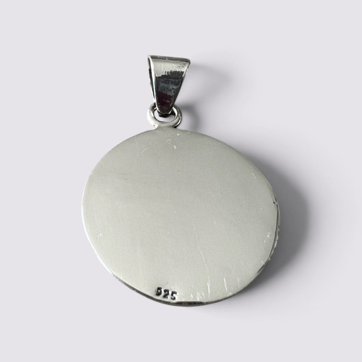The Fashion Jewels handmade silver Mayan calendar pendant featuring a 925 sterling silver stamp on the back.