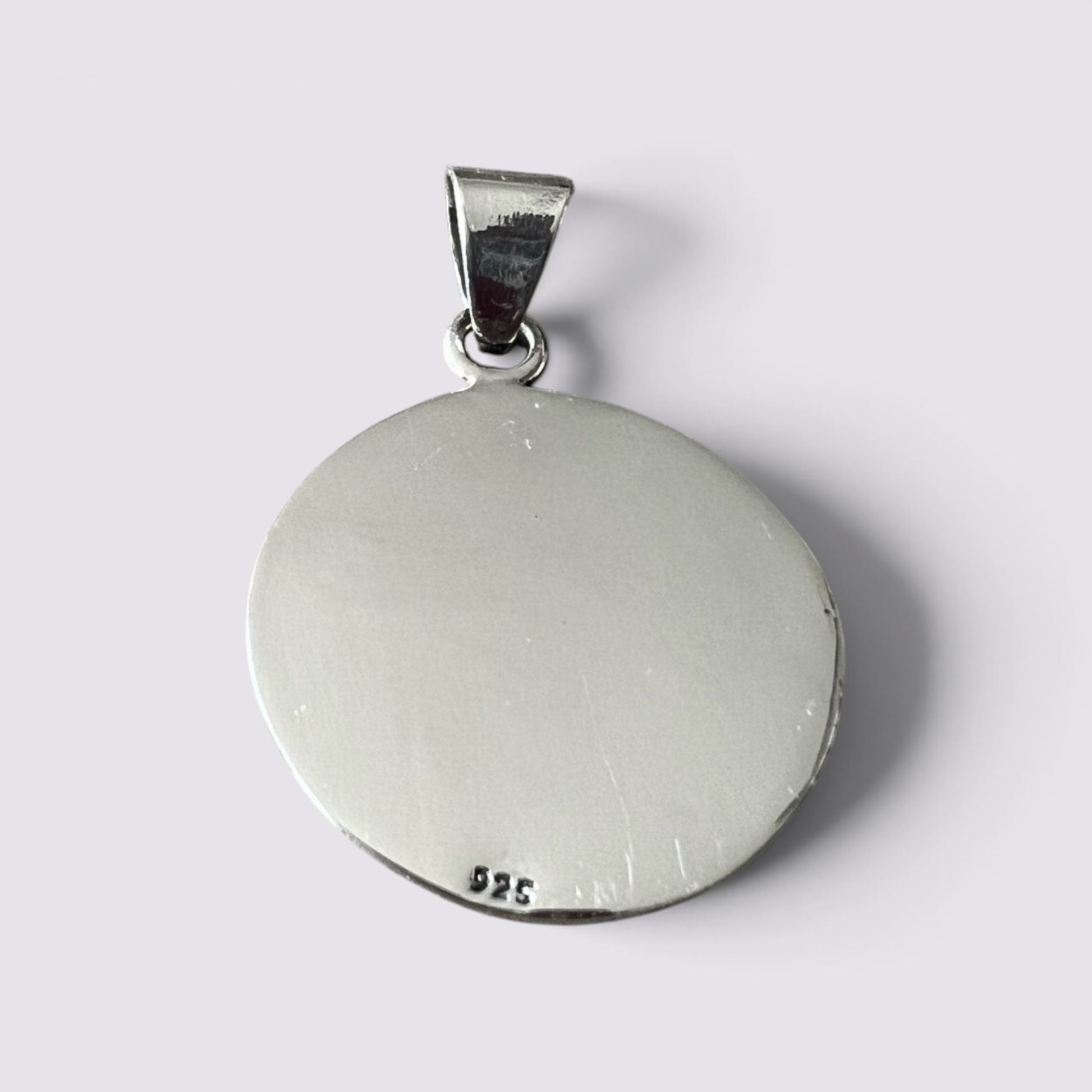 The Fashion Jewels handmade silver Mayan calendar pendant featuring a 925 sterling silver stamp on the back.