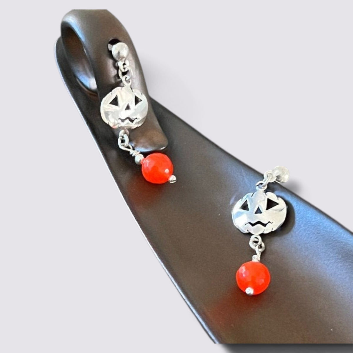 The Fashion Jewels sterling silver jack-o'-lantern dangle earrings with faceted orange beads for Halloween.