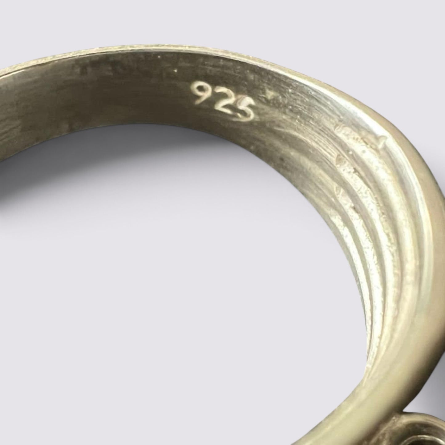The Fashion Jewels sterling silver ring showing a 925 hallmark stamp on the inner band