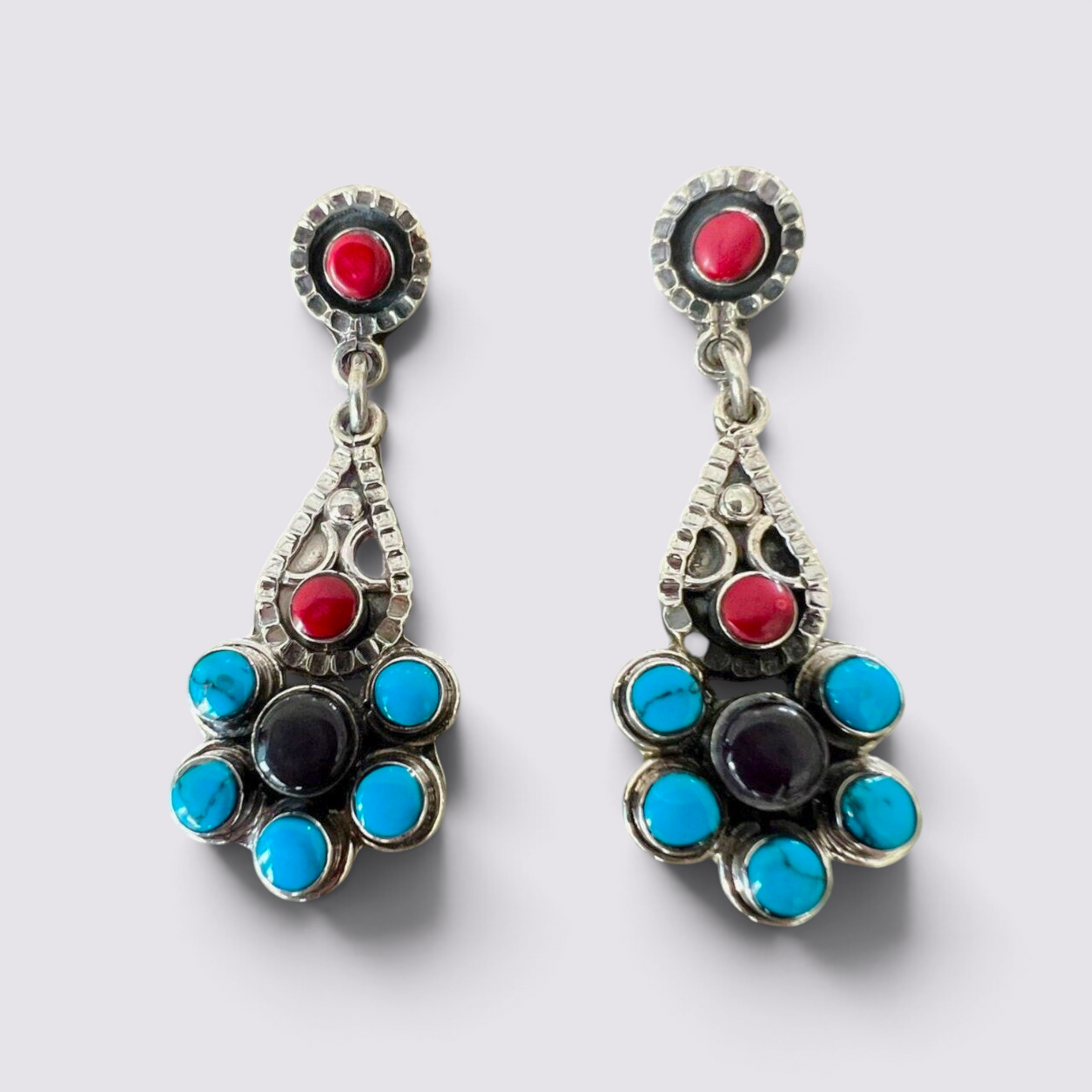 The Fashion Jewels sterling silver dangle earrings with turquoise, red coral, and black stones in a Byzantine design.