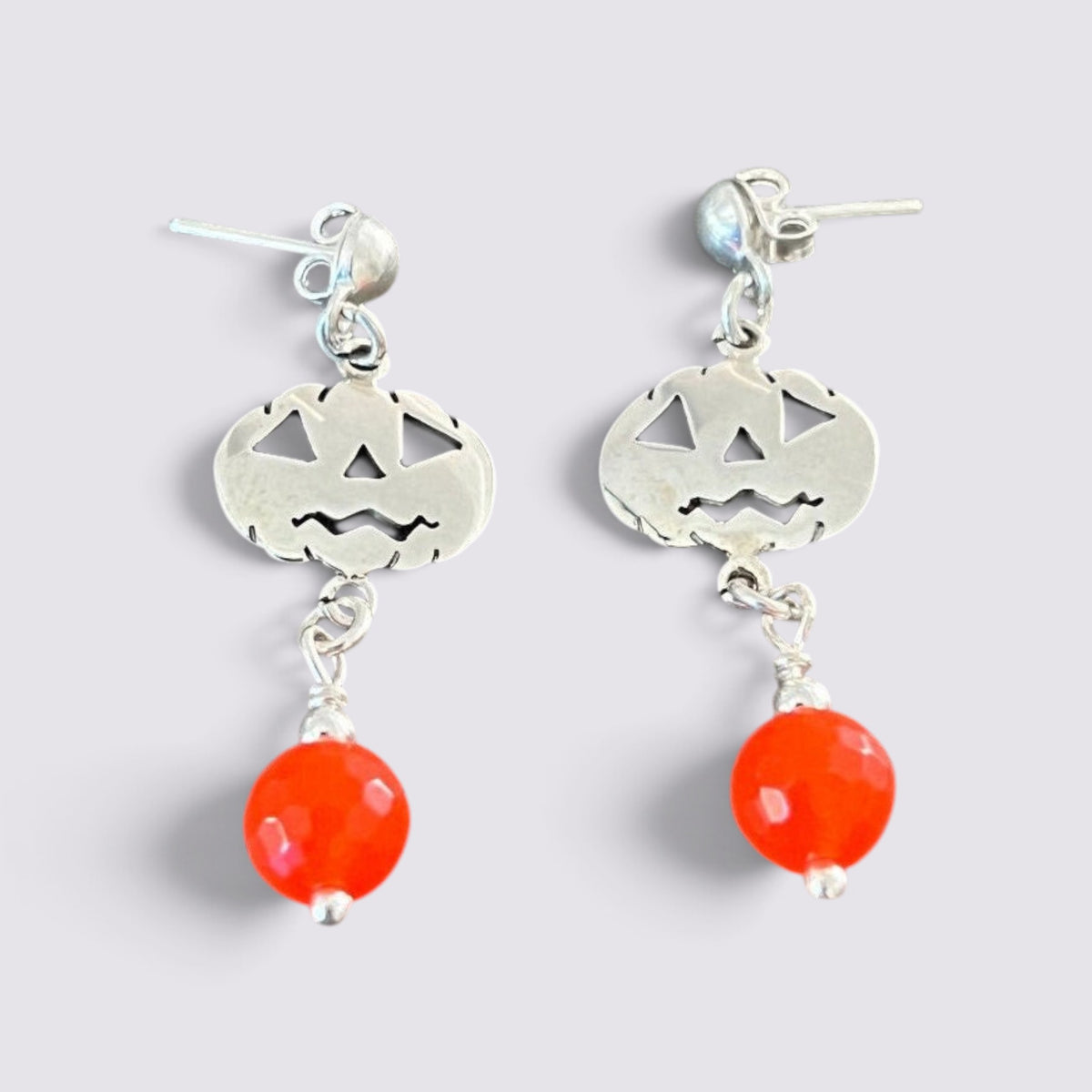 The Fashion Jewels sterling silver jack-o'-lantern dangle earrings with faceted orange beads for Halloween.