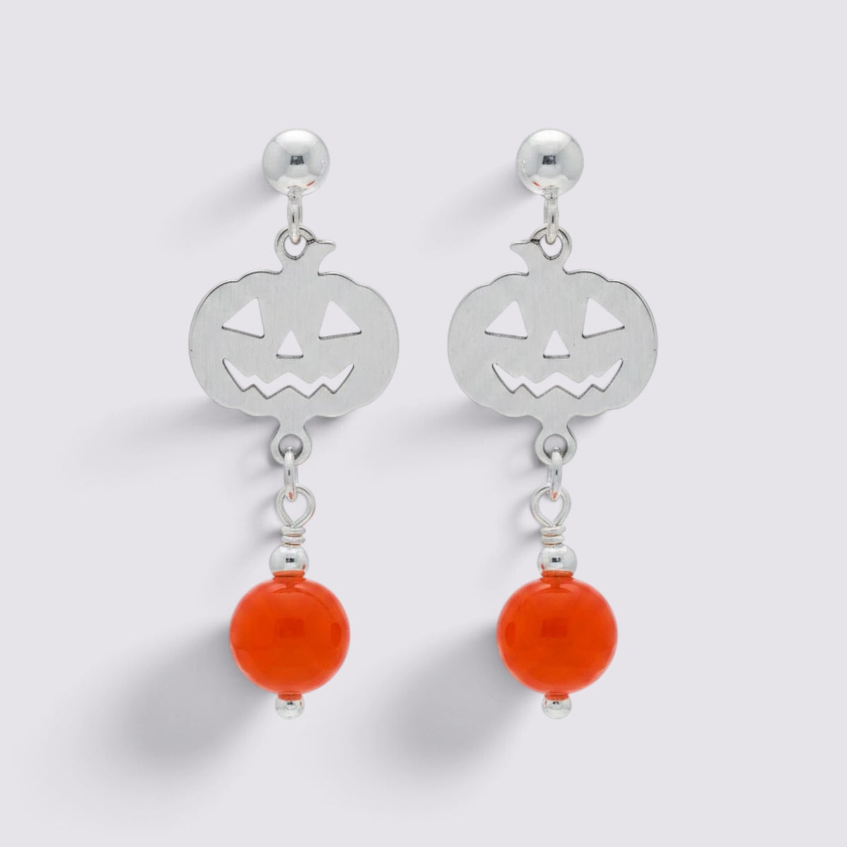 The Fashion Jewels sterling silver jack-o'-lantern dangle earrings with faceted orange beads for Halloween.