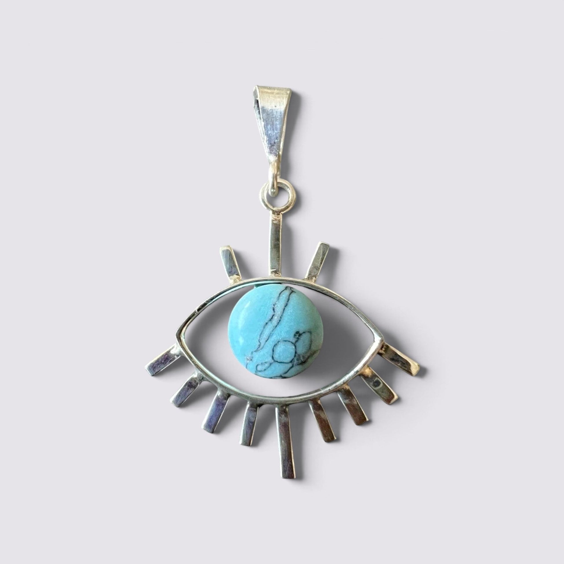 The Fashion Jewels sterling silver evil eye pendant featuring a round turquoise stone with black veining.