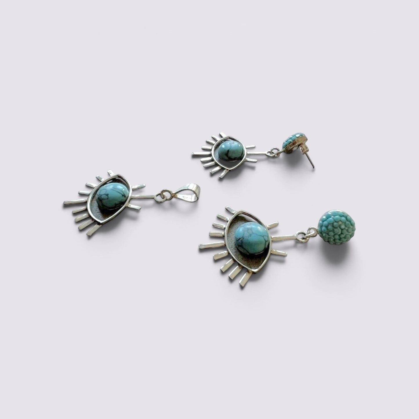 The Fashion Jewels sterling silver evil eye jewelry set featuring turquoise charms in celestial sunburst designs.