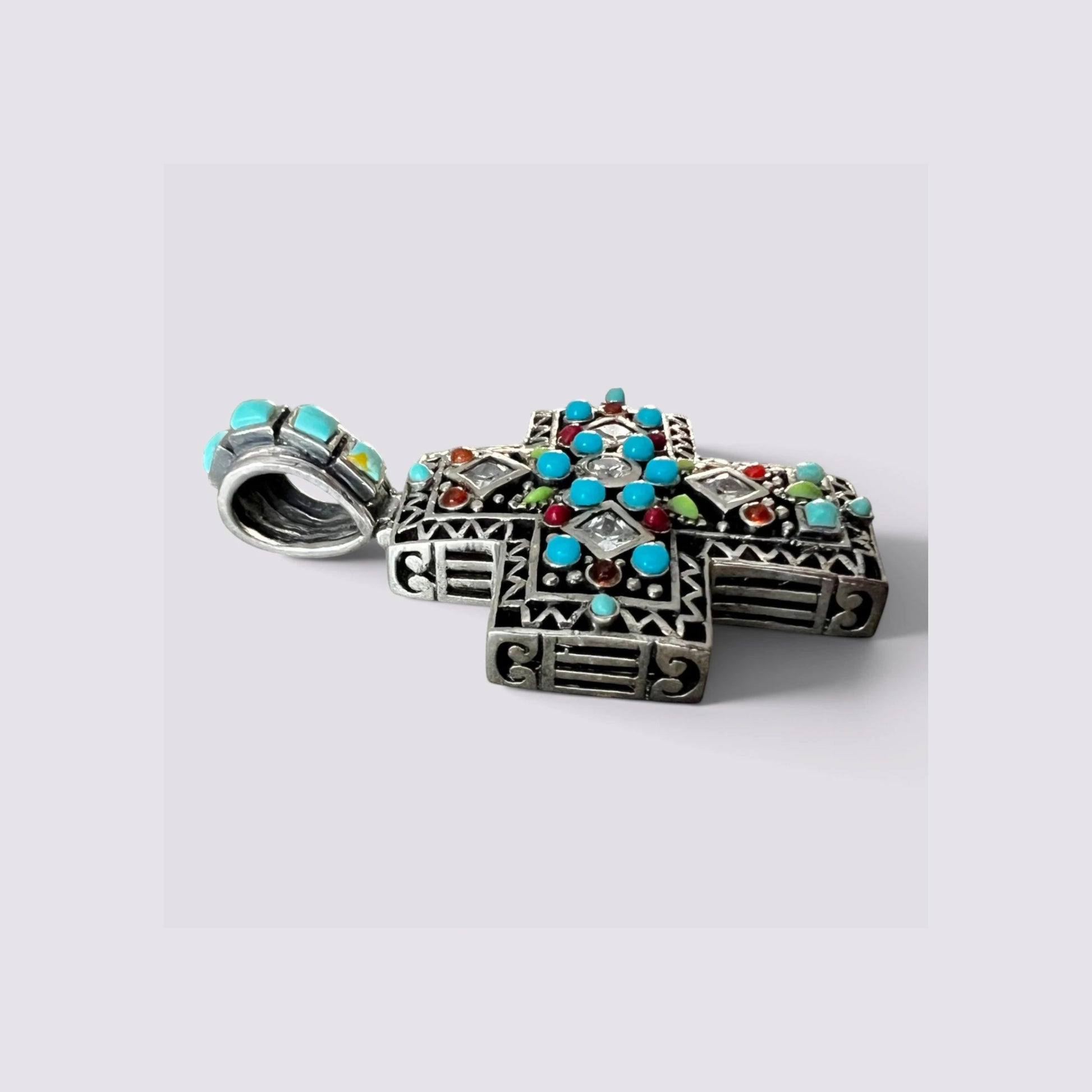 The Fashion Jewels oxidized sterling silver cross pendant featuring turquoise, zircon, and multicolor gemstone inlays.