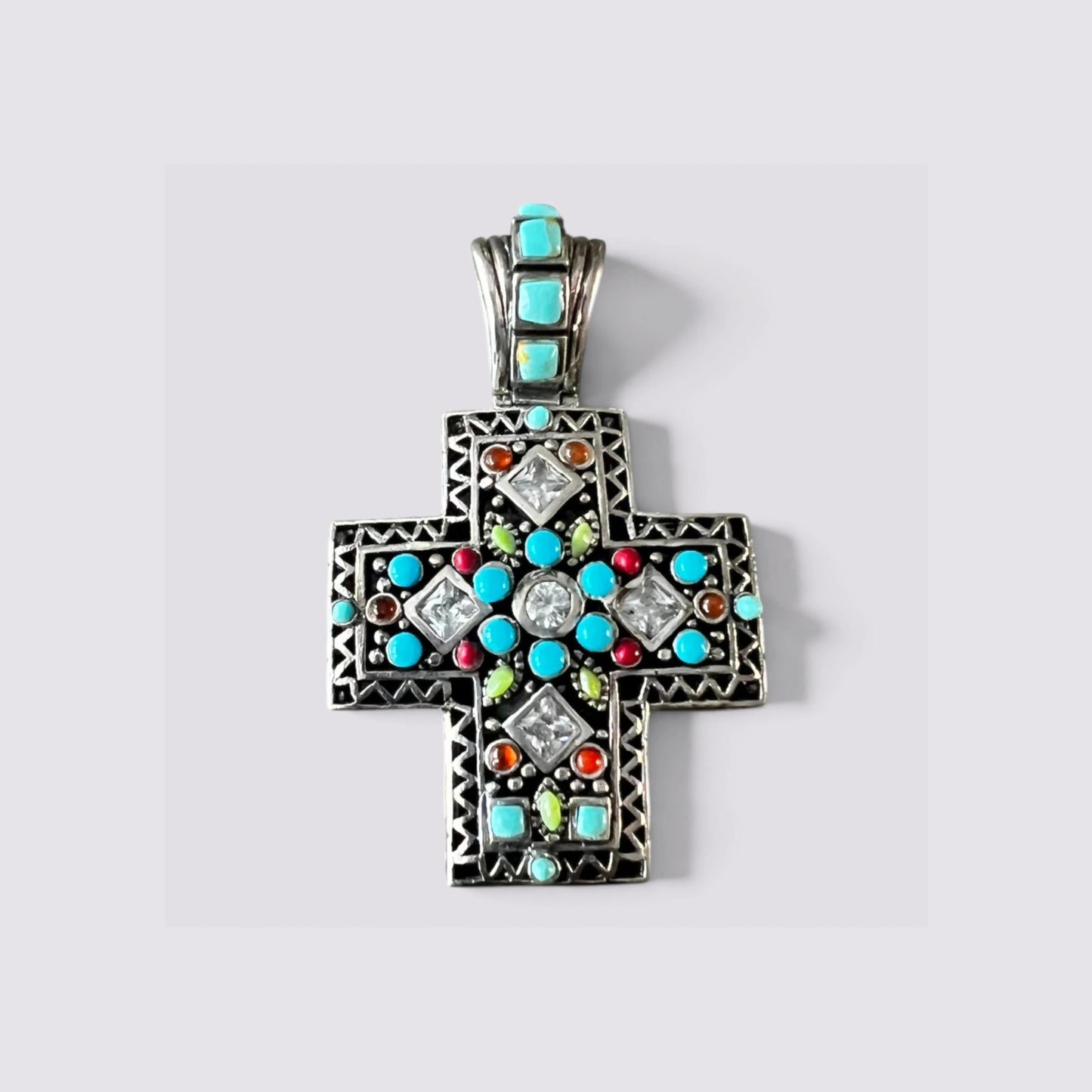 The Fashion Jewels sterling silver cross pendant with turquoise, white zircon, and multicolor stones in oxidized metal.