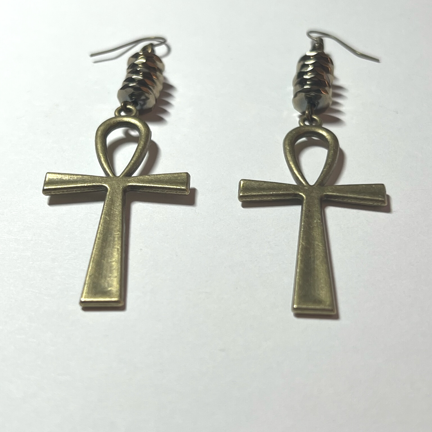 Golden hematite pyrite earrings with cross charm