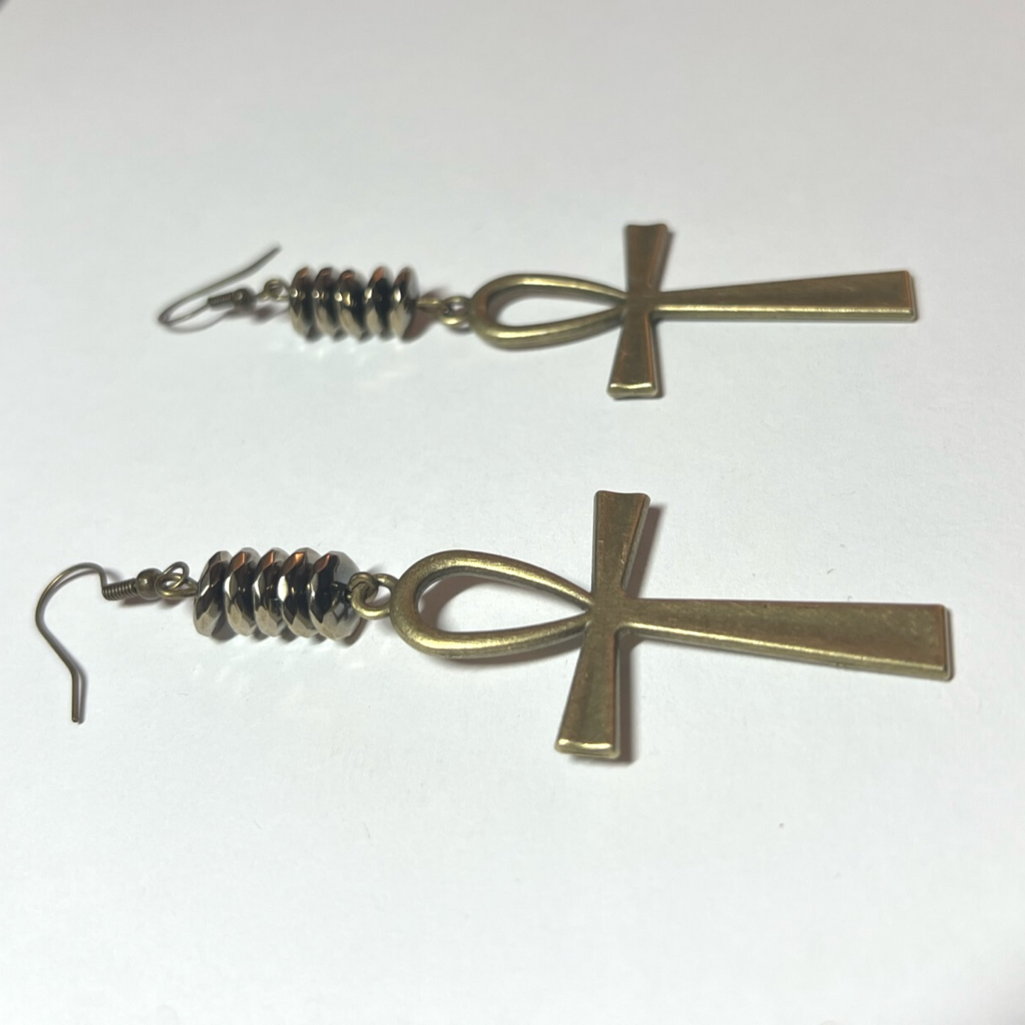 Golden hematite pyrite earrings with cross charm