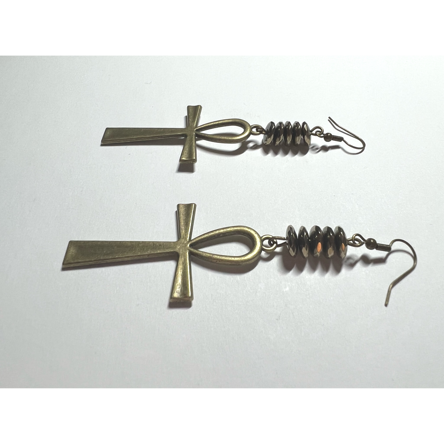 Golden hematite pyrite earrings with cross charm