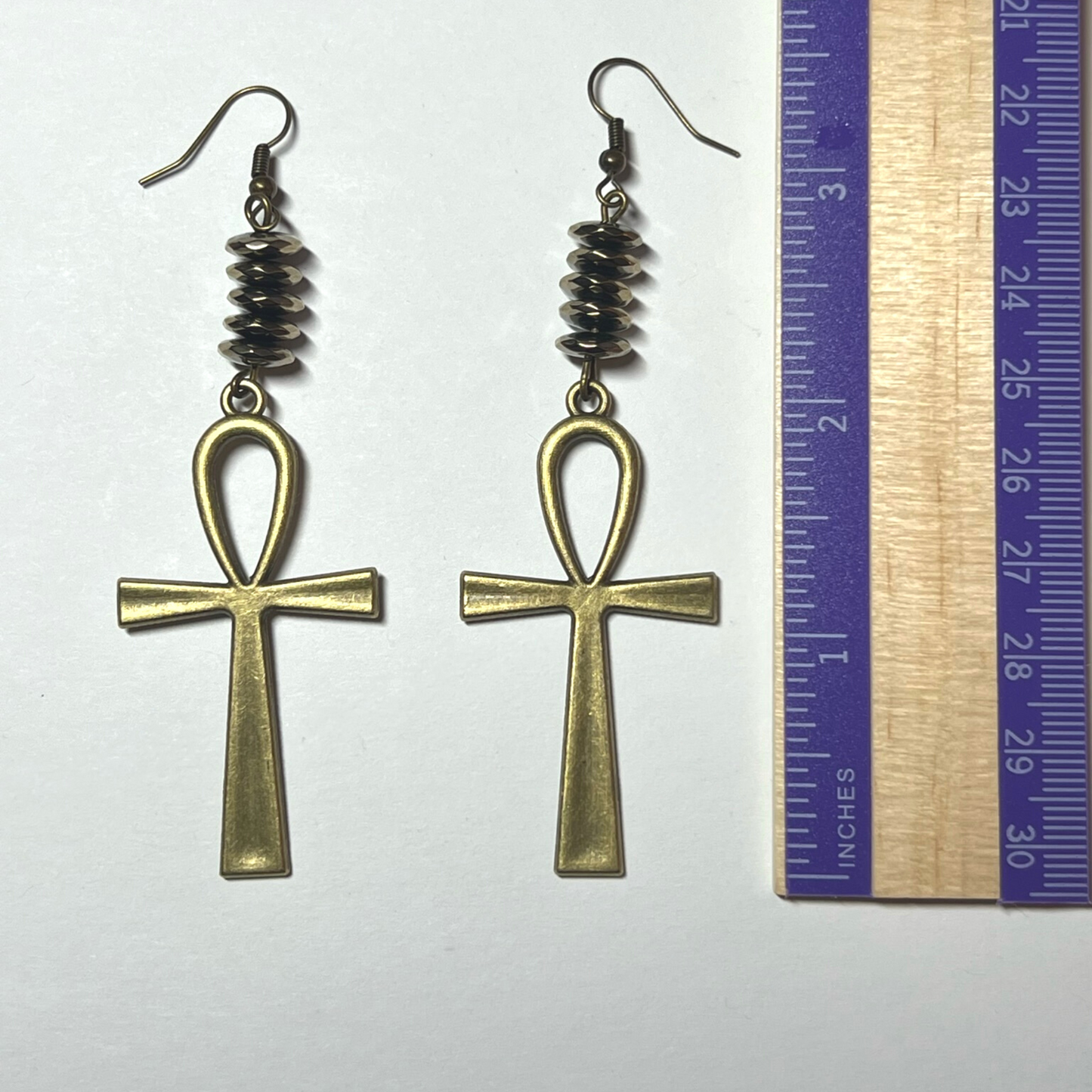 Golden hematite pyrite earrings with cross charm