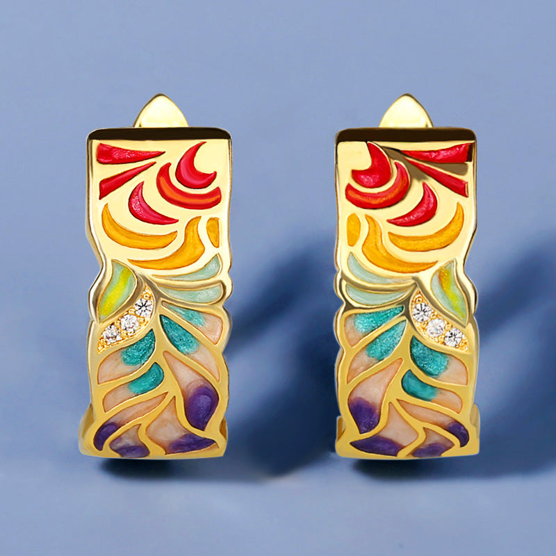 Exquisite 925 sterling silver earrings in gold tone with hand enameled multi-color leaves.