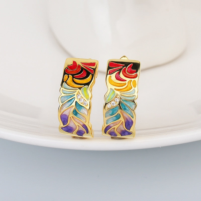 Exquisite 925 sterling silver earrings in gold tone with hand enameled multi-color leaves.