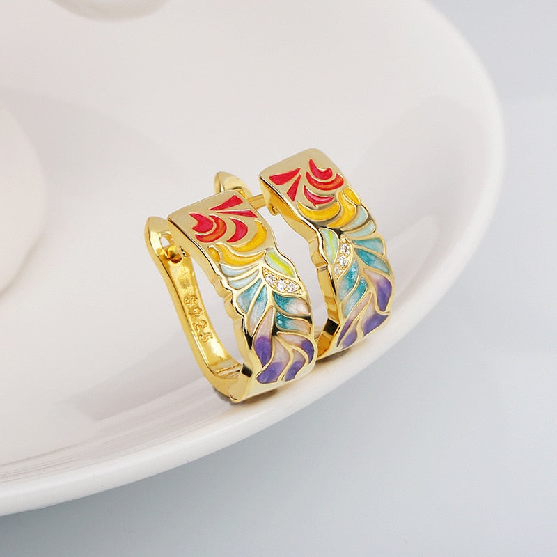 Exquisite 925 sterling silver earrings in gold tone with hand enameled multi-color leaves.