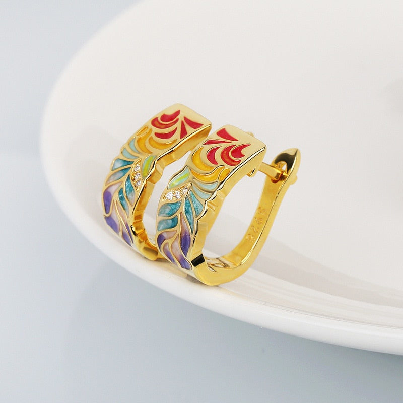 Exquisite 925 sterling silver earrings in gold tone with hand enameled multi-color leaves.